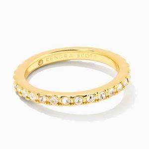 Kate gold band ring in white crystals.